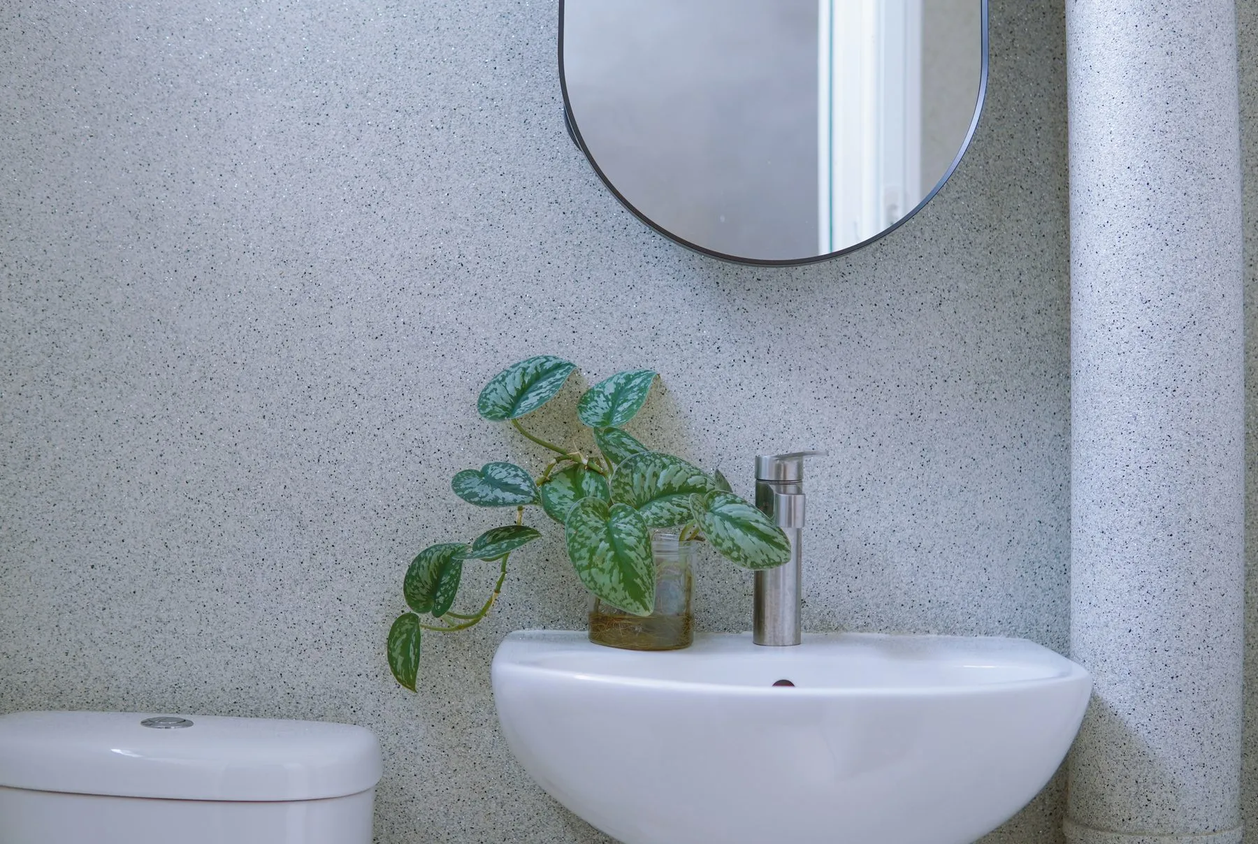 IFS Epoxy Flake Lining on a bathroom wall behind a basin and mirror