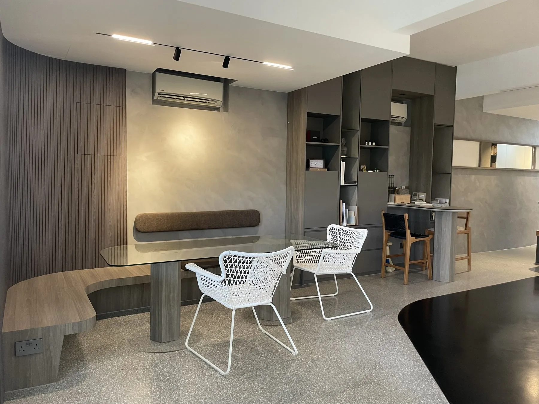 IFS Japanese terrazzo floor in a dining area with a curved bench and white chairs