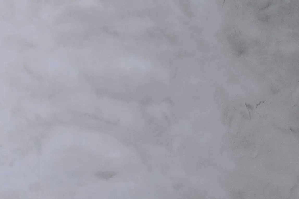 Close-up of the soft, mottled grey texture of IFS MicroCrete microcement
