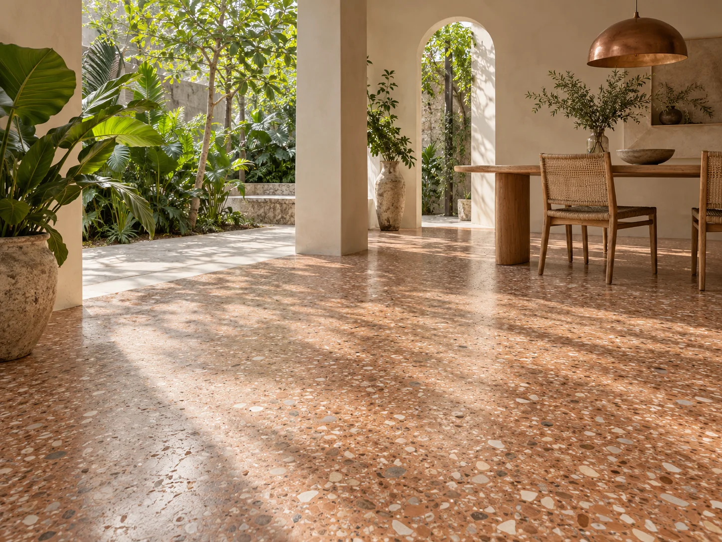 Concept courtyard dining space with muted terracotta terrazzo flooring